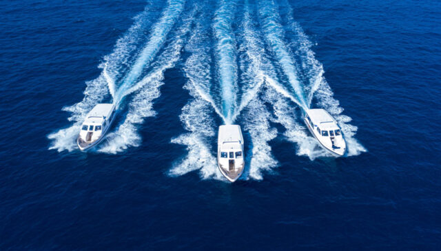 A high-speed luxury speedboat cutting across clear Maldivian water, representing Maldives Speed boat Transfers and unmatched reliability.